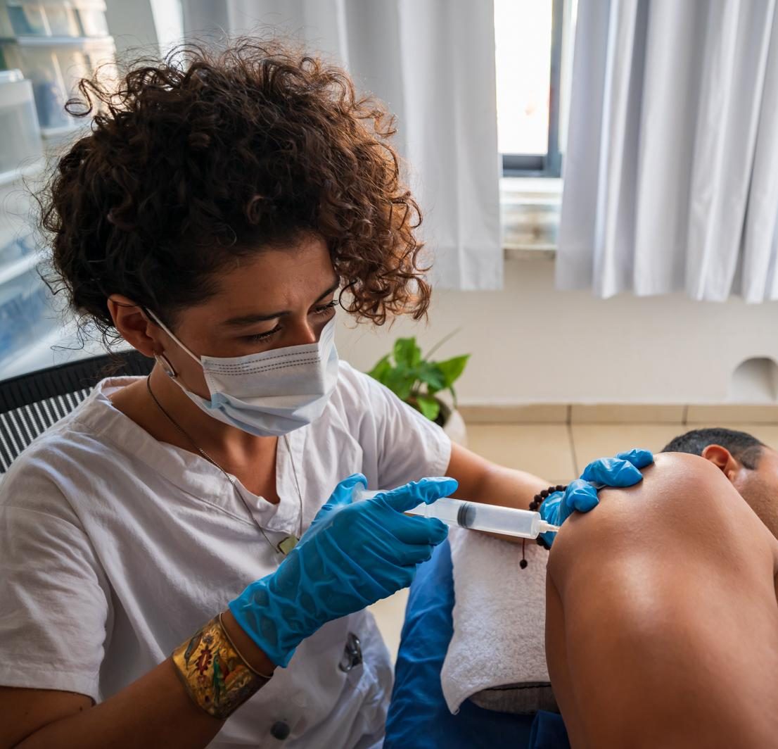 Local ozone therapy by injecting ozone into the shoulder tissue